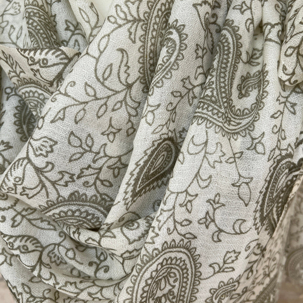 Close-up of paisley patterned cashmere pashmina in green and white