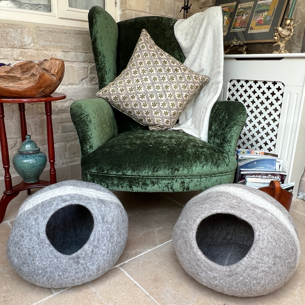 Treat your furry friend to a sanctuary crafted with care.

This handmade felted wool pet cave combines luxury with purpose—soft, warm, and breathable for ultimate comfort. Crafted from 100% New Zealand wool and coloured with natural dyes, it&#39;s completely chemical-free and kind to the environment.

The chocolate and cream striped design adds understated elegance to any space, while its versatile nature means it works beautifully as a pet bed, mat, or storage solution.  Shown against a green velvet armchair.