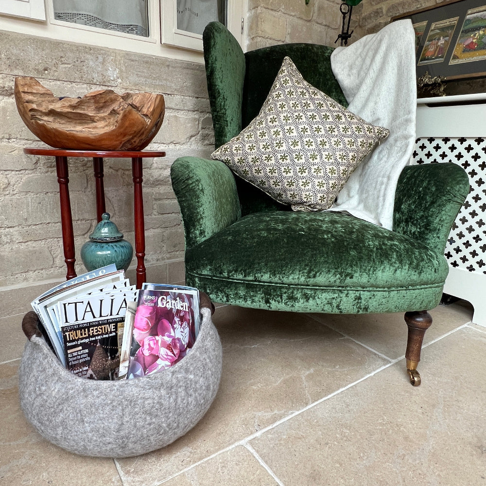 Elegant, expertly handcrafted pure wool felted storage basket, featuring rich brown wool handles.

This durable and eco-conscious piece combines strength with refined appeal, making it perfect for stylish storage or display in any space. It also offers a charming, snug haven for your cat or small dog.

Produced by a small family enterprise dedicated to fair wages and sustainable methods, the basket is crafted from 100% New Zealand wool dyed with natural, environmentally friendly pigments. Its breathable woo