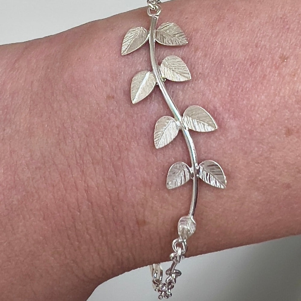 Handcrafted Silver &#39;Leaf&#39; Bracelet by Lily&#39;s Leaves shown on a grey and white marble surface