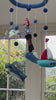 Handcrafted, felted wool Children's mobile with pirate and sea-themed toys hanging from a blue ring 