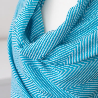Cashmere Wrap / Scarf - Turquoise Herringbone design on a mannequin against a white background. 