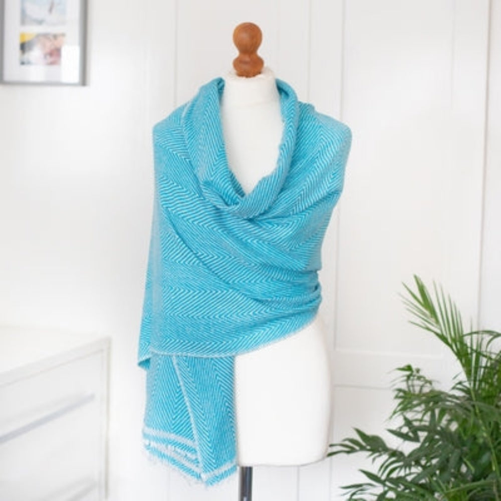 Cashmere Wrap / Scarf - Turquoise Herringbone design on a mannequin against a white background. 