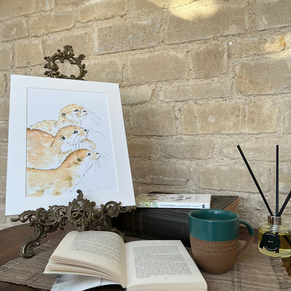 ‘Otters at Play’ is a delightful limited edition watercolour print by artist Linda Beazley.

&nbsp;This charming mounted artwork perfectly captures the joyful spirit and playful energy of otters in their natural habitat, bringing a splash of fun and warmth to any room. Its vibrant details and lively composition make it an eye-catching addition to your home or office, sparking smiles and lighthearted conversation.

