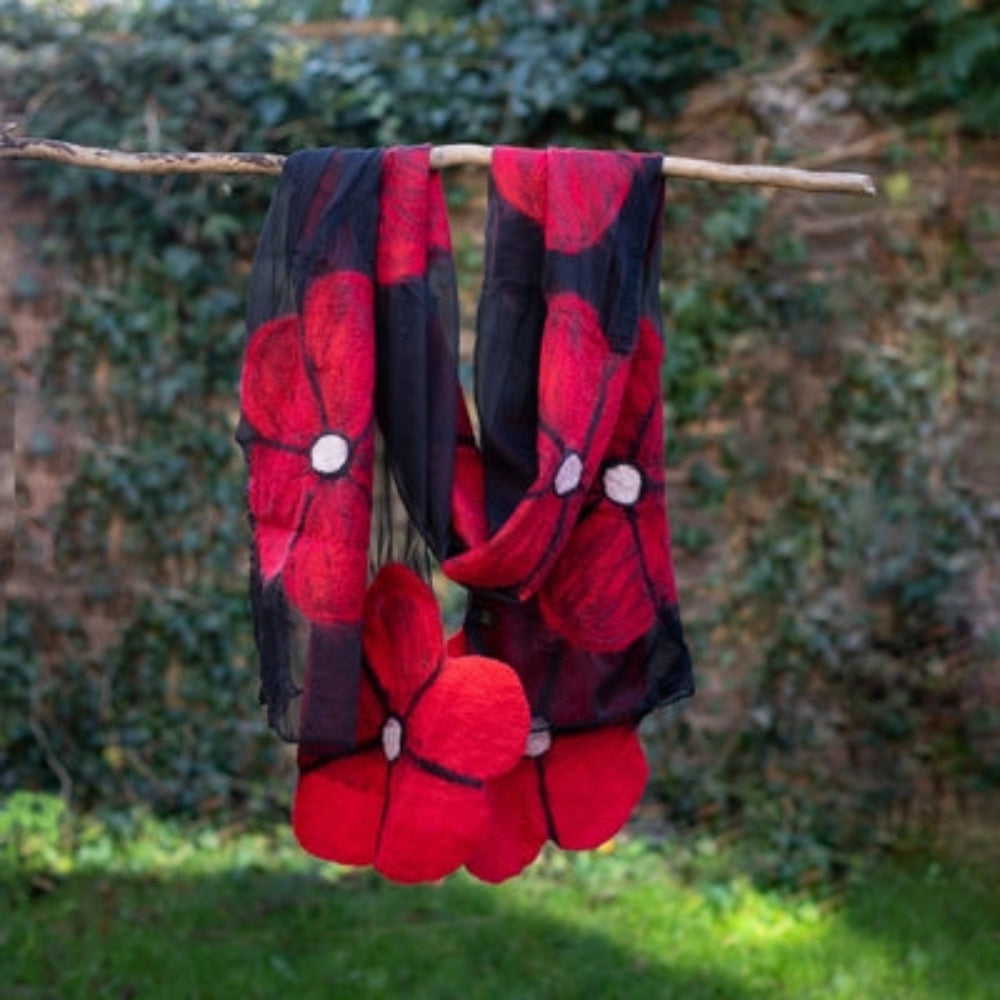 Merino Wool Scarf. Black chiffon background and a Red Flower decoration