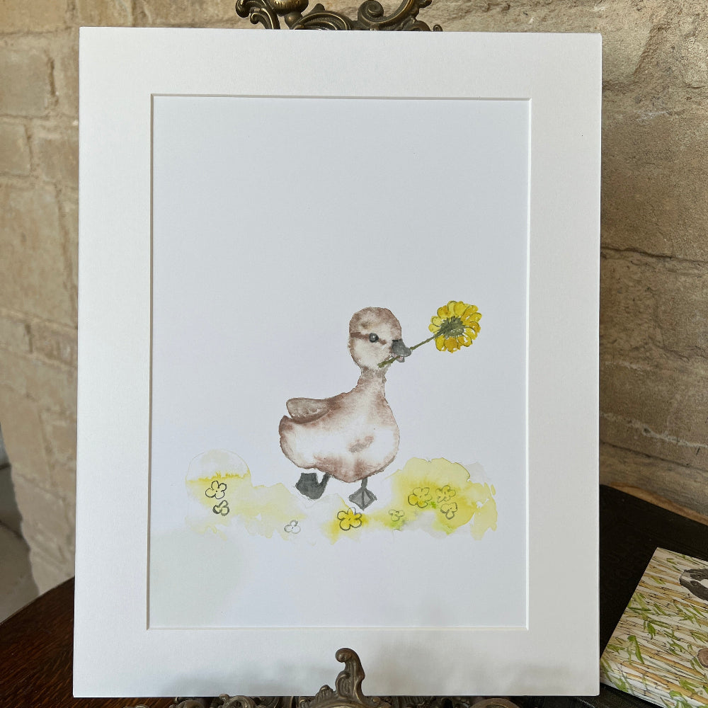 

&#39;Dandelion Duckling&#39; is a charming limited edition mounted print by artist Linda Beazley.

This delightful watercolour print captures a sweet duckling surrounded by fluffy dandelion seeds, bringing a whimsical touch to any room. Perfect for art lovers and nature enthusiasts alike, it brightens your space with a splash of playful elegance.

Whether gifted or kept as a treasured keepsake, this enchanting print invites joy and warmth into your home. Hurry—this exclusive piece is sure to flutter away quickly!