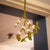 Our Mistletoe offers a refined touch to your holiday décor, perfect for creating memorable Christmas gatherings. Made from felted New Zealand wool, its pliable wired stems let you adjust the shape to suit your style.

This durable and eco-friendly ornament measures around 12" (30.48 cm) long, designed for enduring festive charm year after year. Shown in a gold decorative bowl, with candles and festive decoration against a cotswold stone wall. 
